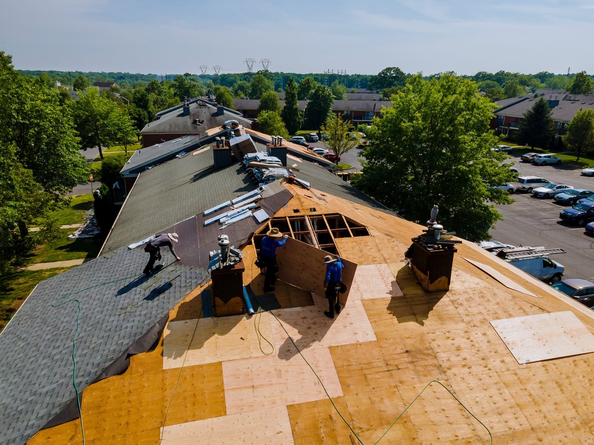 Roof shingles before and after replacement